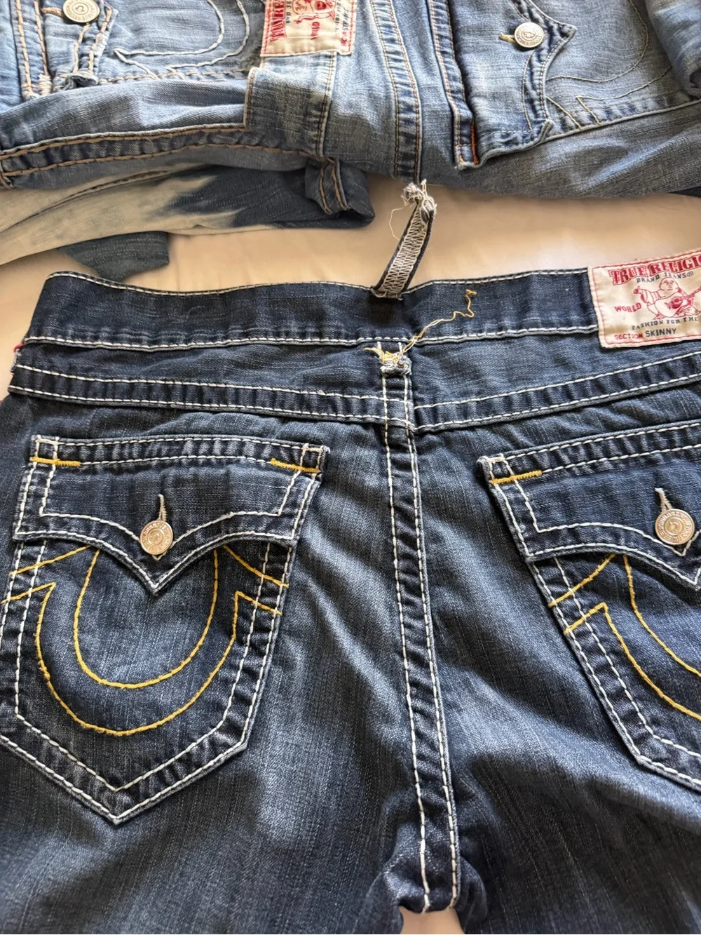 True Religion men’s street cut Jeans in Dark Indigo with Yellow Stitching